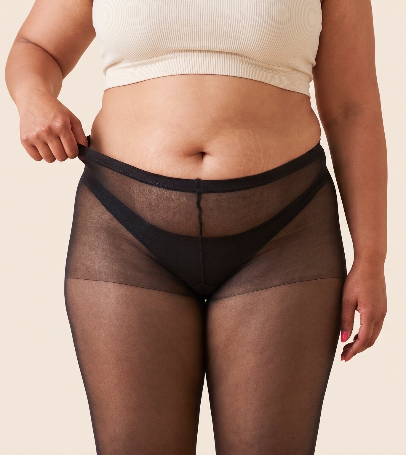 Avant : collant classique dont la fine ceinture roule sous le ventre